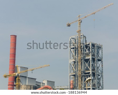 Industrial zone, Steel pipelines and crane in factory.