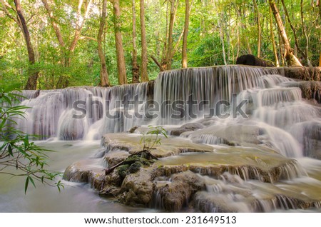 Waterfall in deep rain forest jungle (Huay Mae Kamin Waterfall in Kanchanaburi Province, Thailand)