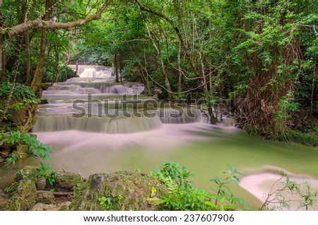 Waterfall in deep rain forest jungle (Huay Mae Kamin Waterfall in Kanchanaburi Province, Thailand).
