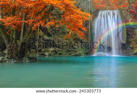 Wonderful Waterfall with rainbows in deep forest at national park, Thailand.