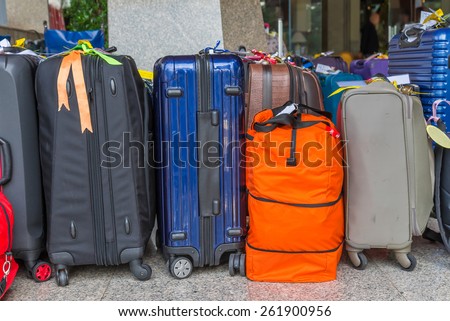 Luggage consisting of large suitcases rucksacks and travel bag.