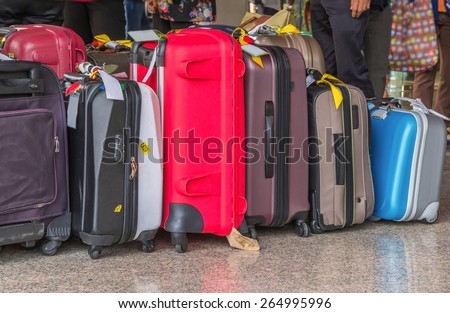 Luggage consisting of large suitcases rucksacks and travel bag.