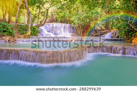 Waterfall in rain forest wit rainbow (Tat Kuang Si Waterfalls at Luang prabang, Laos.)