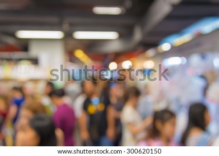 Blur of shopping at supermarket convenience store.
