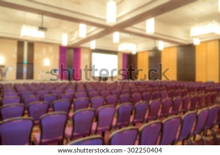 Blur of empty chair in meeting or conference room.
