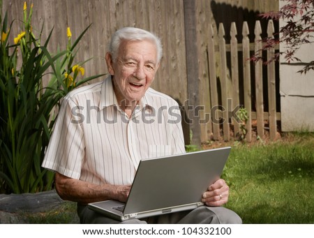 Old man senior citizen with laptop computer