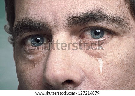 Tears In Eyes Of Crying Adult Man