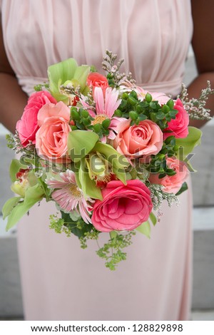 Wedding bouquet held by African-American bridesmaid