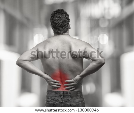 Lower back pain on fit man isolated injury concept