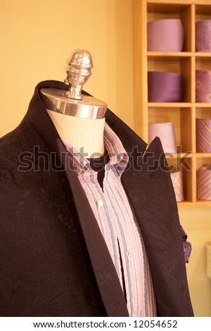 Mannequin in interior of upscale men's clothing store