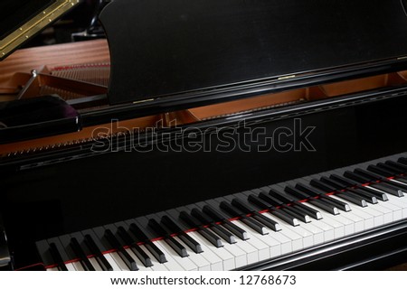 Closeup of ebony grand piano music keys