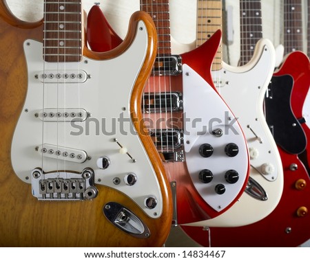 Electric guitars hanging on wall of music shop