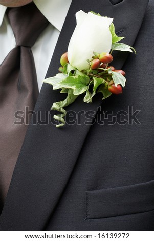 White Rose Wedding Boutonniere On Suit of Groom