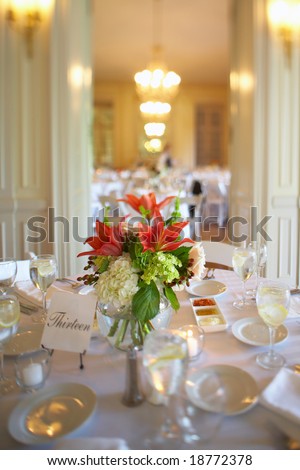 Table set for an event party or wedding reception DOF focus on bouquet