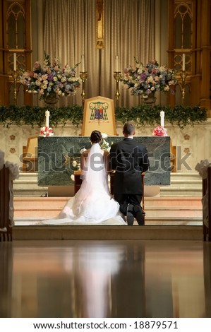Bride and groom at church wedding alter ceremony