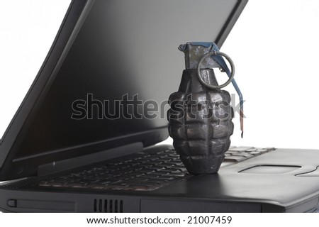 Computer terrorism concept, grenade on laptop
