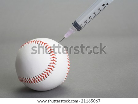 Syringe needle injected into baseball on grey background