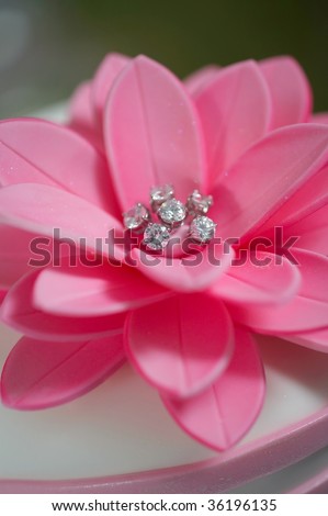 stock photo Pink wedding cake top detail with diamonds