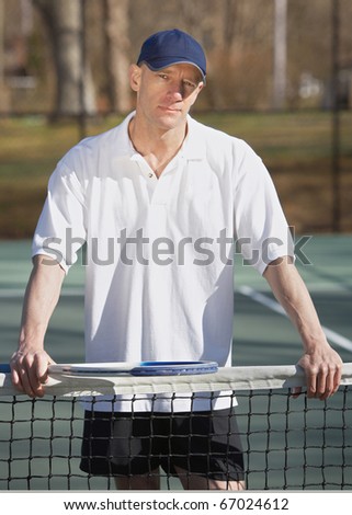 Handsome pro tennis player ready for sports competition