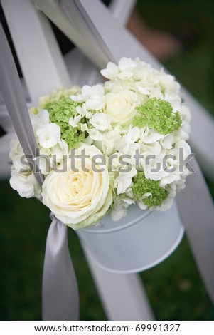 stock photo Wedding bouquets of roses at outside ceremony