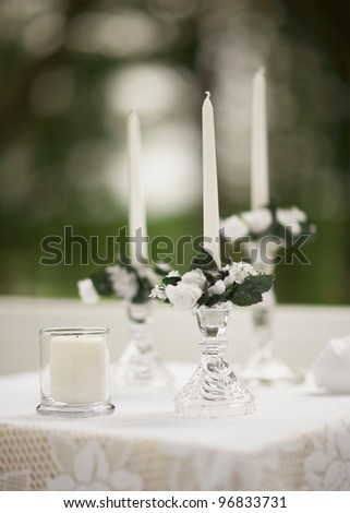 Candles outside wedding ceremony detail