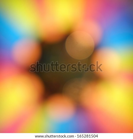 Blurred amusement park game rainbow lights background