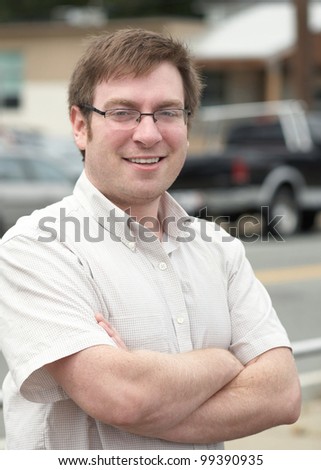 Confident smiling young man outdoor portrait