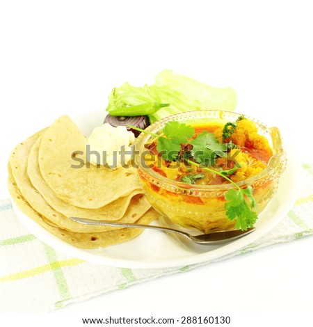 indian food vegetable cauliflower masala shaak dish with tortilla