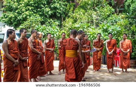 SINGBURI, THAILAND-AUGUST 15: Buddhist monks are standing waiting for the joining date of birth father Charan on August 15, 2013 AmpawanTemple Phrom Buri district. Sing Buri Province, Thailand.