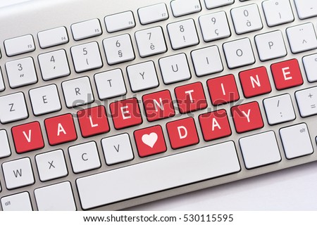 VALENTINE DAY writing on white keyboard with a heart sketch