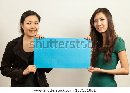 Blank card, Young woman holding card that can be replace with everything you want, namecard sign etc... shoot on isolated white background