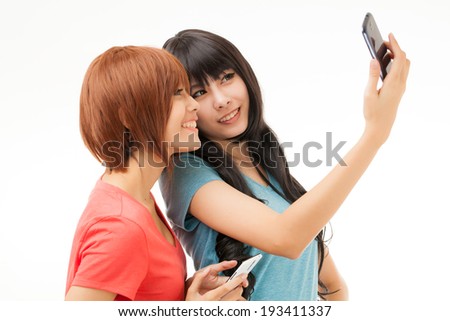 Asian woman taking self potrait selfie with mobile phone