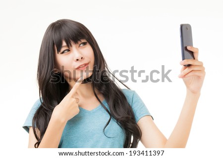 asian woman taking self portrait selfie with mobile phone
