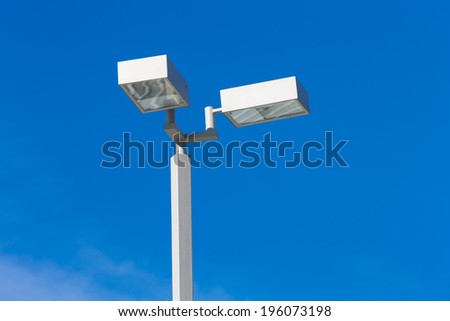 modern light pole with blue sky