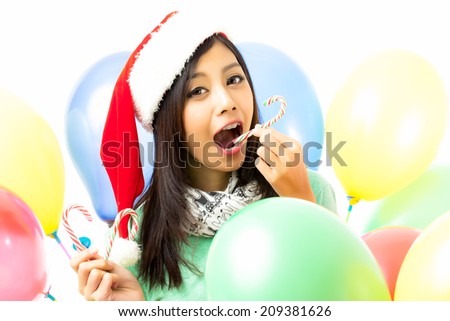 Asian woman celebrating christmas shooting in white background