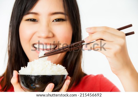 asian woman enjoy eating rice shooting in studio