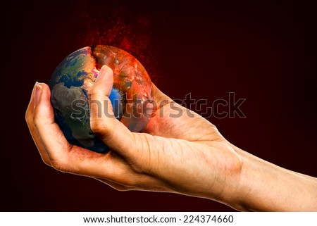 Ecology concept, holding the Earth in hands, destroying it, Elements of this image furnished by NASA