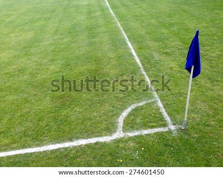 blue corner flag on soccer green field