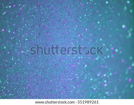 Glitter bokeh sparkling colorful background.