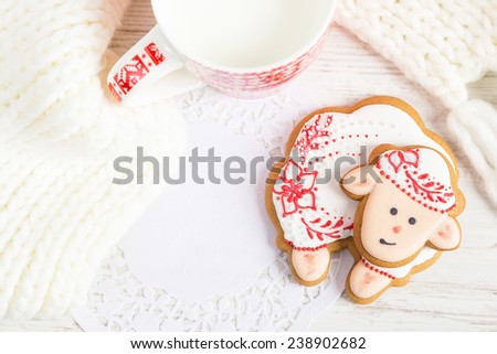 Christmas gingerbread sheep with cup of milk. Top view. Copy space