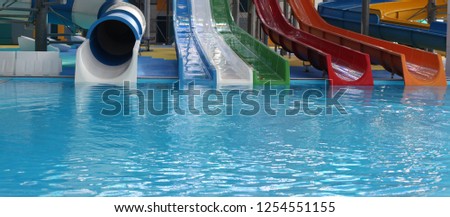 Water park. Blue pool slide swimming. Aquapark.