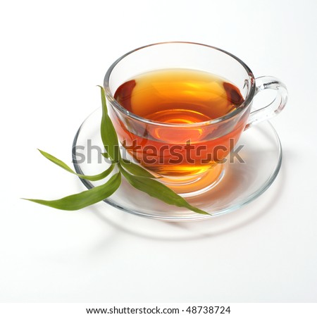 stock photo : cup with tea and green leaf