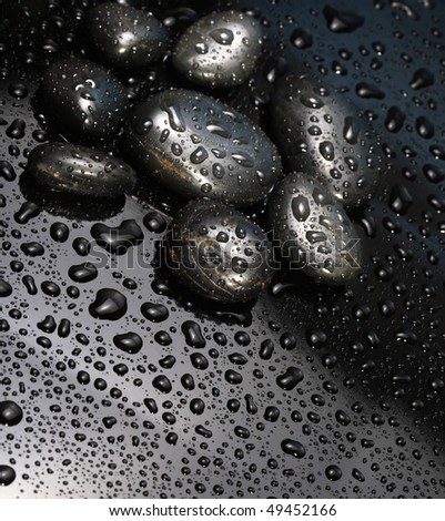 black stones with water drops