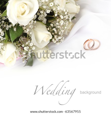 stock photo wedding rings and roses bouquet