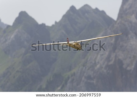 VAL DI FASSA, COL DEL CUC, ITALY - JULY 28: Radio controlled model airplane in flight in a Euromeeting Fly, July 28, 2013 in Val Di Fassa, Pordoi, Col del Cuc, Italy