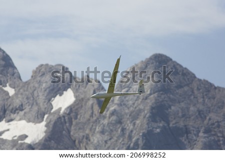 VAL DI FASSA, COL DEL CUC, ITALY - JULY 28: Radio controlled model airplane in flight in a Euromeeting Fly, July 28, 2013 in Val Di Fassa, Pordoi, Col del Cuc, Italy