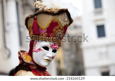 Venice, Italy - February 11 2012: Woman with typical venetian carnival costume at the Carnival of Venice. Shot in St. Mark's Square..