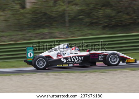 Imola, Italy - October 11, 2014: A Tatuus F.4 T014 Abarth of  Jenzer Motorsport team, driven By Valente Alan (Che),  the Italian F4 Championship car racing on October 11, 2014 in Imola, Italy.
