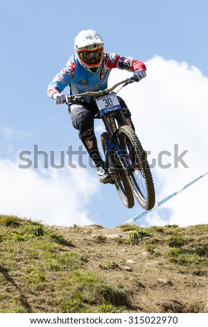 Val Di Sole, Italy - 22 August 2015: Ms Mondraker Team,  Rider Pekoll Markus in action during the mens elite Downhill final World Cup at the Uci Mountain Bike in Val di Sole, Trento, Italy