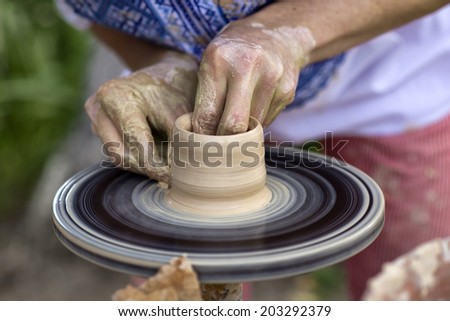 A potter at work on a potter\'s wheel